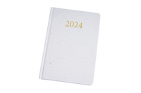 2024 daily planner, white cover with gold '2024' title