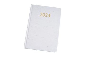 2024 daily planner, white cover with gold '2024' title