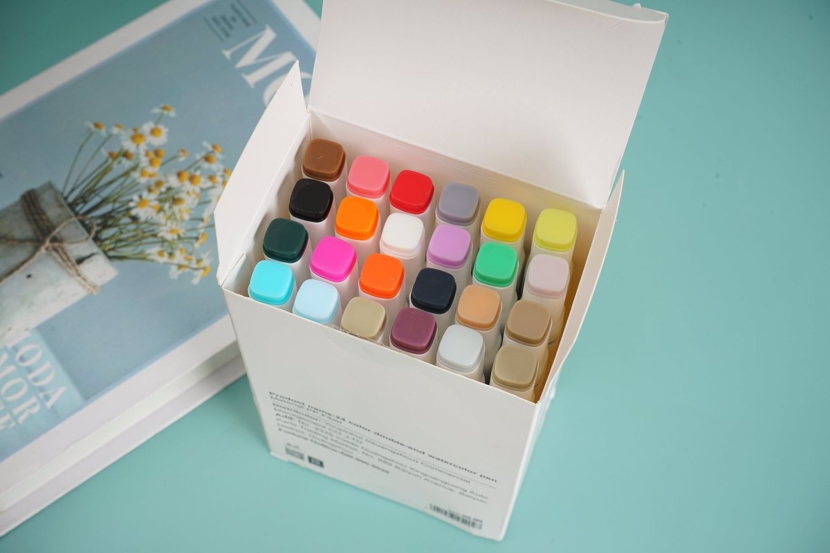 Double-ended watercolor pen set in open box with multicolor caps and nibs