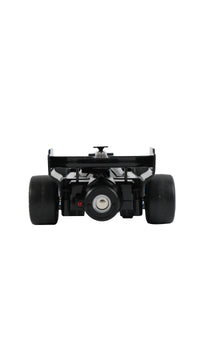 Black remote control racing car with rear wing, rear view