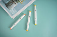 3-color highlighter set with three white markers, orange and yellow tips/caps.