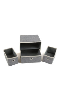 Grey fabric drawer organizer with three sections open, showing empty interior bins