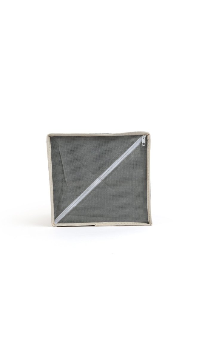 Grey fabric organizer with hinged lid closed and diagonal seam detail on top