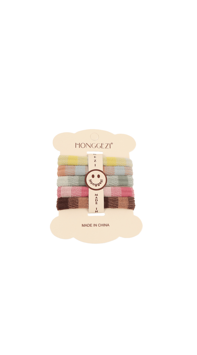 Striped hair ties set in pastel and earth-tone colors on a card