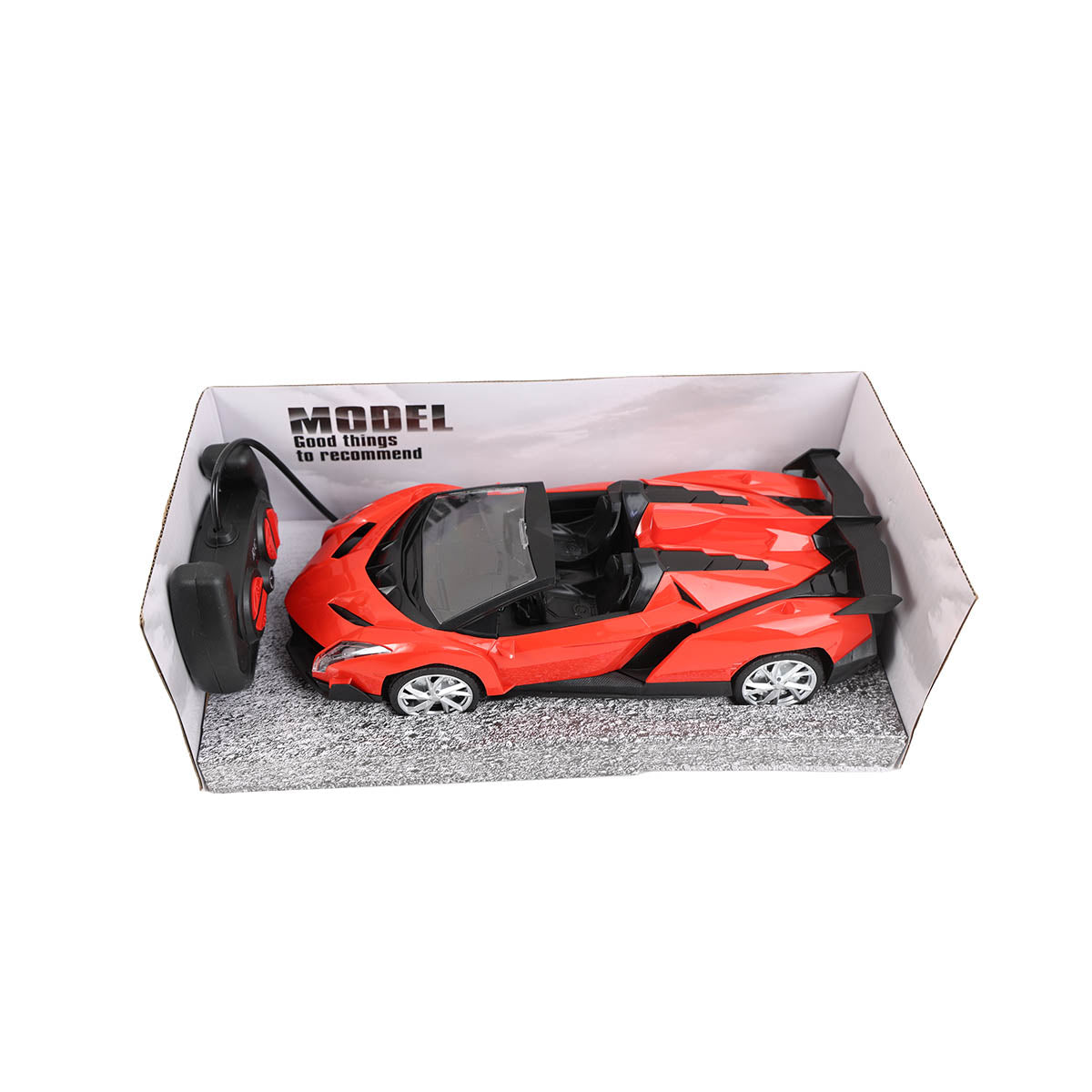 Red sports car and handheld controller displayed in an open tray