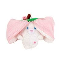 Pink plush bunny opened to reveal a small white bunny inside