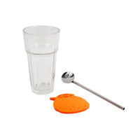 Clear tall glass cup with orange coaster and silver straw