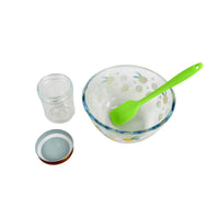 Lemon curd sauce kit set with glass bowl, two jars, and green silicone spatula