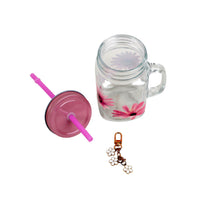 Glass mason jar with pink straw and lid, pink flower decals, plus flower keychain charm