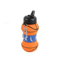 Collapsible silicone water bottle, orange with blue graphic band, black lid and metal clip