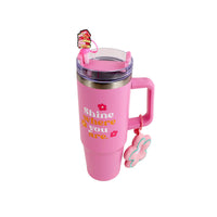 Pink travel mug with flip-top lid, handle, and floral charm keychain