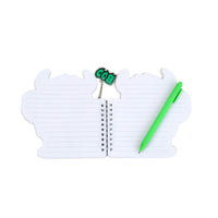 Monster spiral memo pad with green pen and acrylic monster charm, open lined pages