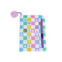 Pixel-pattern notebook with purple pom-pom tassel and zippered pocket