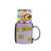 Lavender ceramic mug with pixel art top panel and ‘WELCOME’ speech bubbles