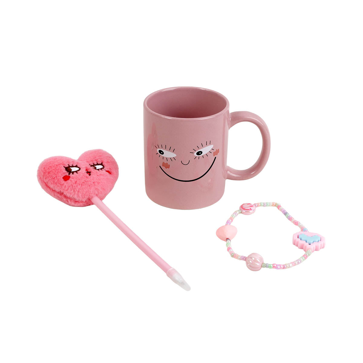 Pink ceramic smile-face mug with heart plush stirrer, beaded bracelet, and pink accessory