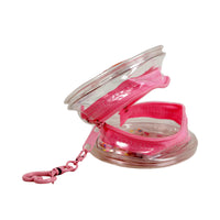 Clear PVC coin purse with pink glitter zipper and heart keychain, open angled view