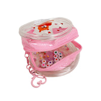 Clear pink PVC coin purse with pink glitter zipper, filled with small heart beads