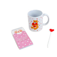 Ceramic bear mug with hearts and paw-print; includes small notebook and heart-shaped accessory
