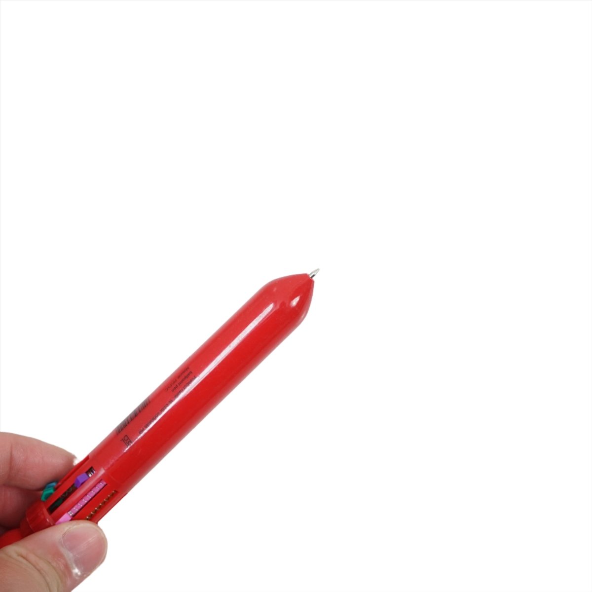 Red Santa Claus 6-color pen tip held in hand, showing nibs at end