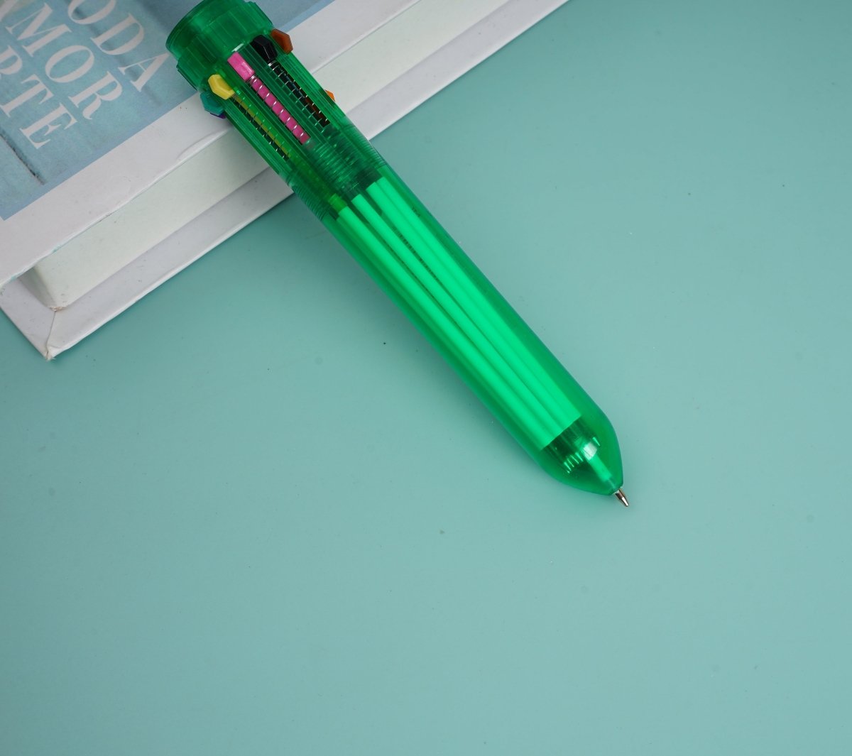Green 6-in-1 multi-color pen, angled view with colored tip inserts
