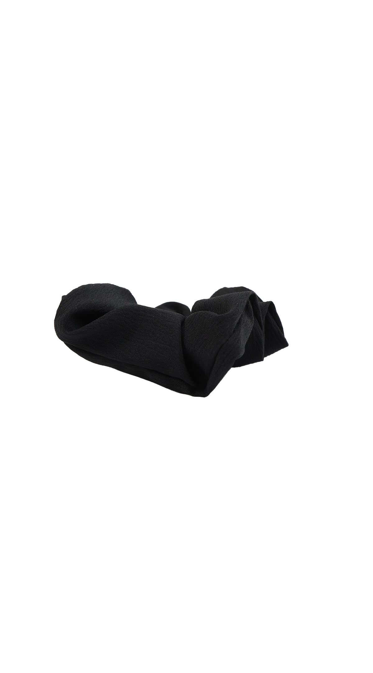 Black fabric hair scrunchie laid flat, gathered elastic band