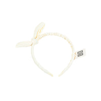White fabric headband with bow and ear-like details