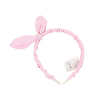 Light pink fabric headband with bow and ear-like details