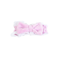 Plush hair band with bow in pink, plush center with ruffled white trim
