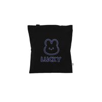 Black tote bag with blue outlined bear icon and 'LUCKY' lettering