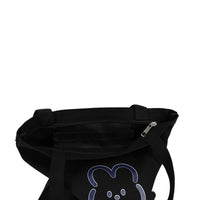 Black tote bag with zipper pocket and partial blue bear graphic on side