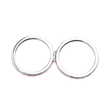 Round double-sided compact mirror with two chrome circles, closed