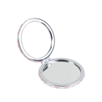 Round double-sided compact mirror with chrome circles open for use
