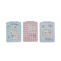 Set of three square double-sided compact mirrors with blue and pink gingham covers