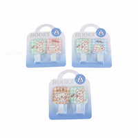 Cartoon metal hooks multipack showing three pairs of white hook bases with animal patches