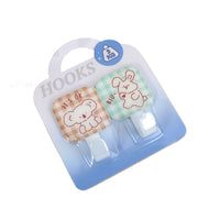 Cartoon metal hooks 2-pack featuring dog and bear patch designs on white hook bases