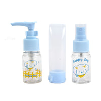 Three clear travel bottles with a pump dispenser, spray nozzle and blue cap