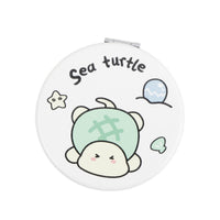 White round double-sided leather mirror with sea turtle illustration