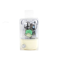 Yellow nail care kit with turtle illustrations in a clear case