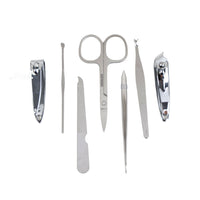 Seven nail grooming tools, including clippers, scissors, tweezers and a file