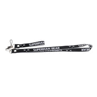 Black phone lanyard with metal clips and repeating SUPERMAN BEAR lettering