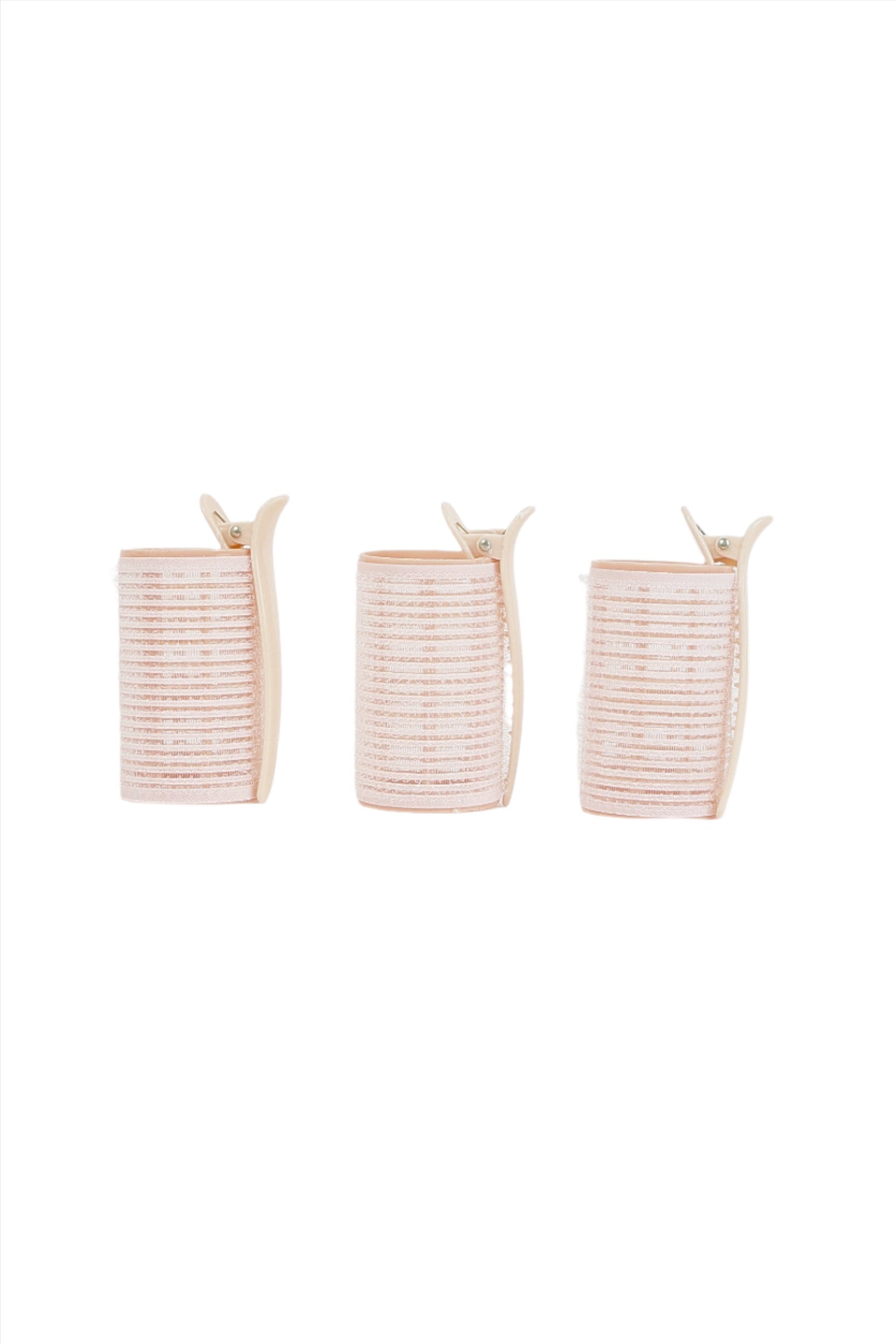 Three light pink hair rollers with beige clips, side-by-side view