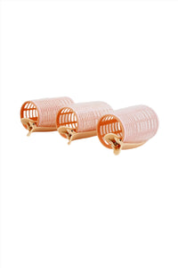 Hair roller set of three light pink cylinders with beige clips