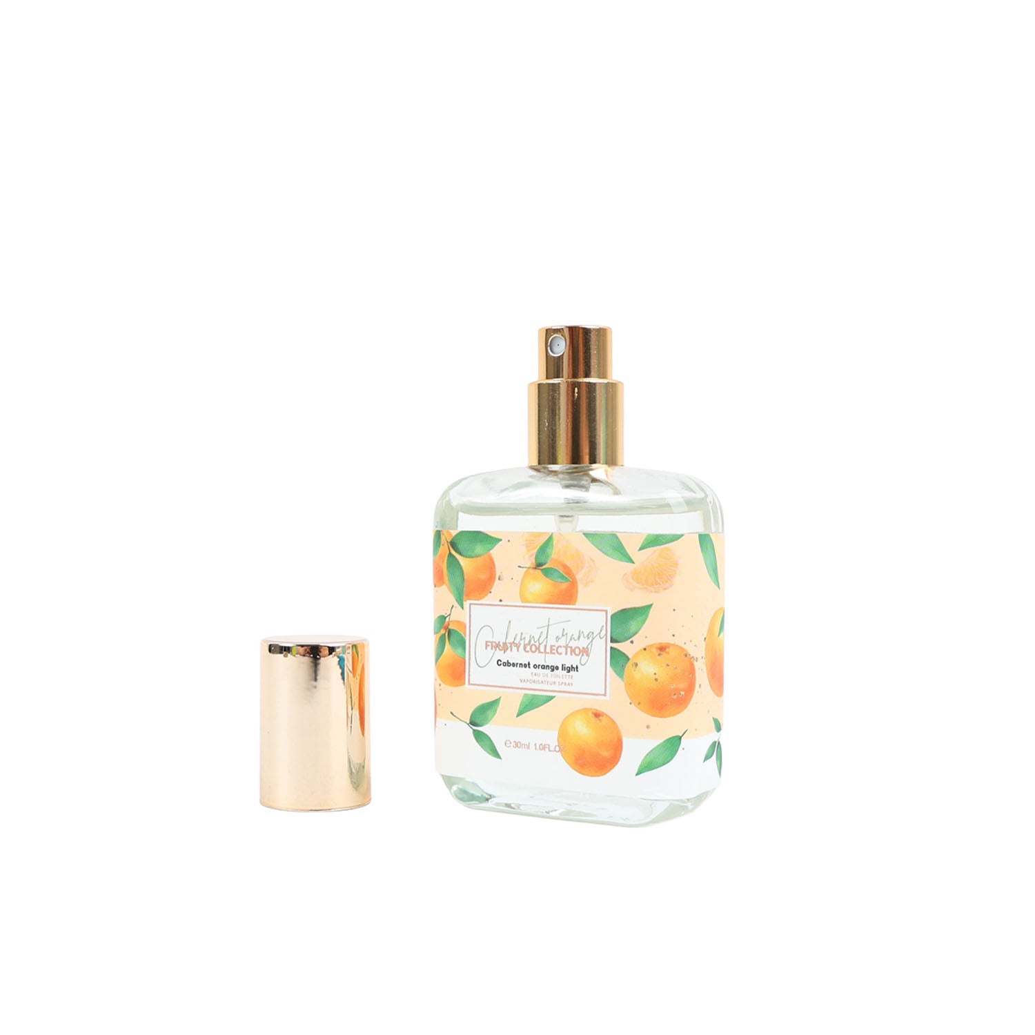 Eau de toilette bottle with gold cap and orange fruit leaf label, plus small accessory