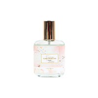 Freesia floral perfume bottle with gold cap and decorative floral label