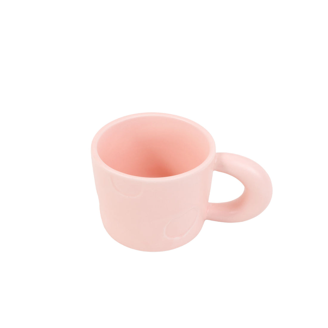 Pink ceramic mug with heart embossed pattern and curved handle