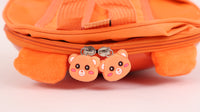 Orange hard shell kids backpack zipper pull with two pink bear charm faces