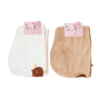 White hair drying cap towel with capybara face patch and small button detail