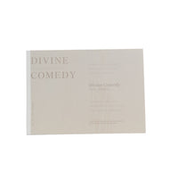 Painting notes book, beige/cream cover with “DIVINE COMEDY” title and faint text