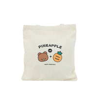 Off-white canvas shoulder bag with pineapple-bear graphic, open-top tote