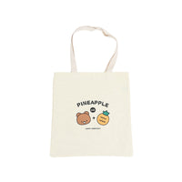 Off-white canvas tote with pineapple-bear graphic, loop handles